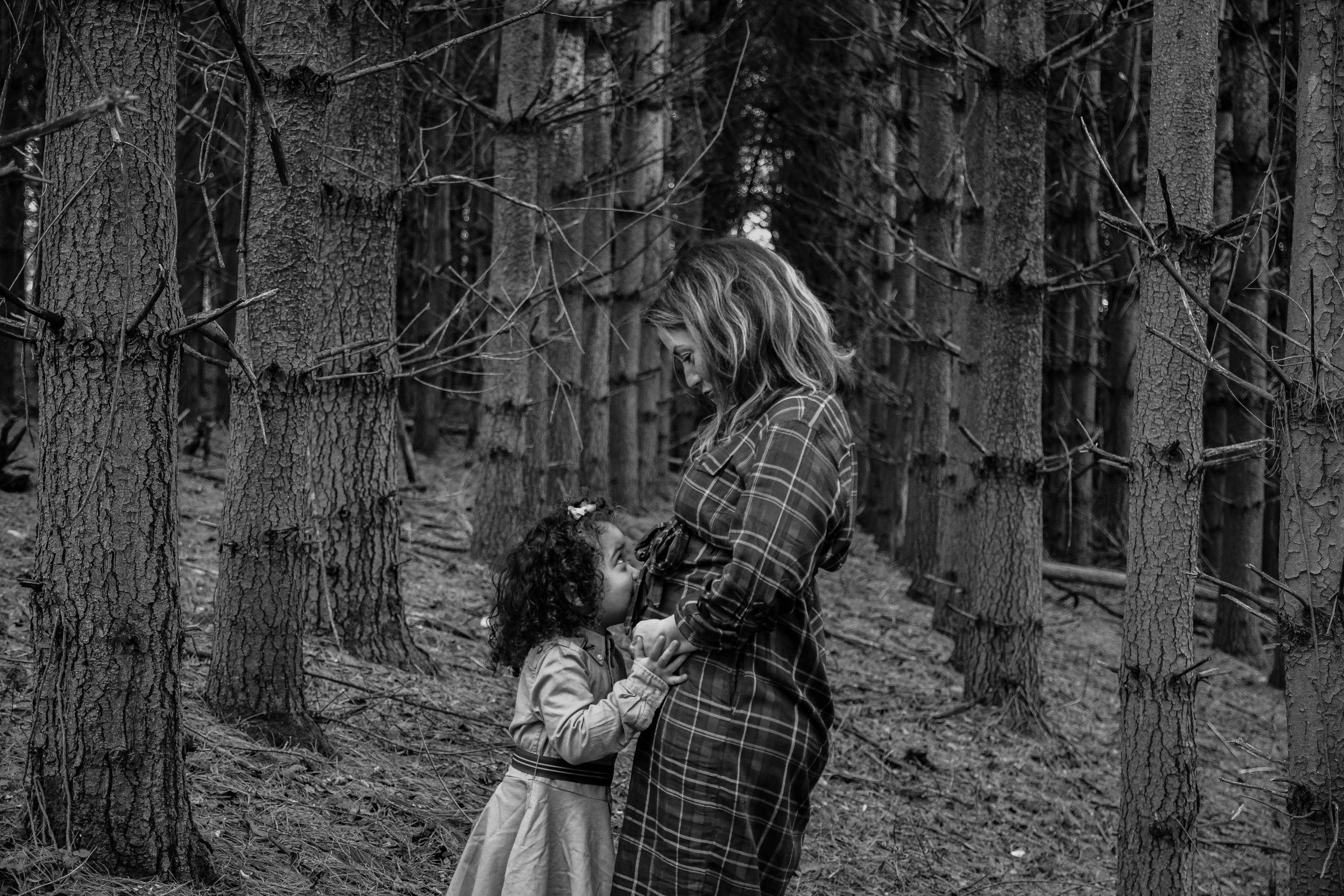 Girl kissing tummy